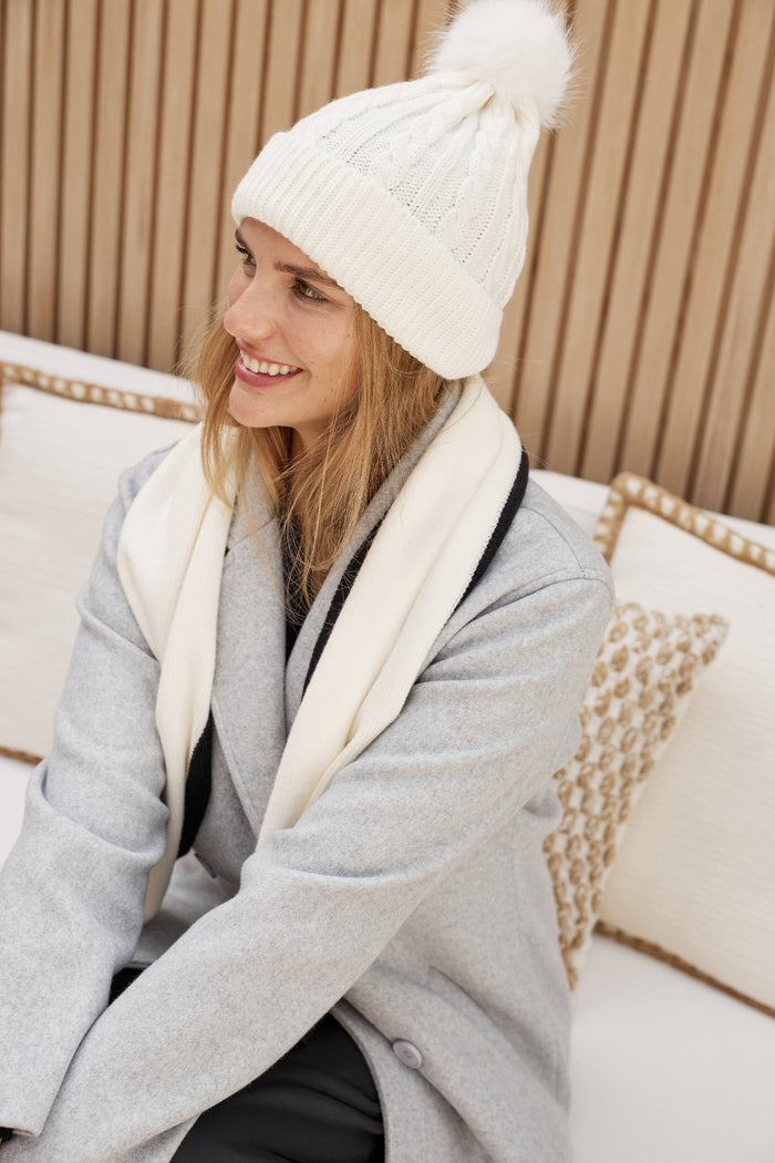 Tessa Cable Knit Beanie in Cream campaign on model side