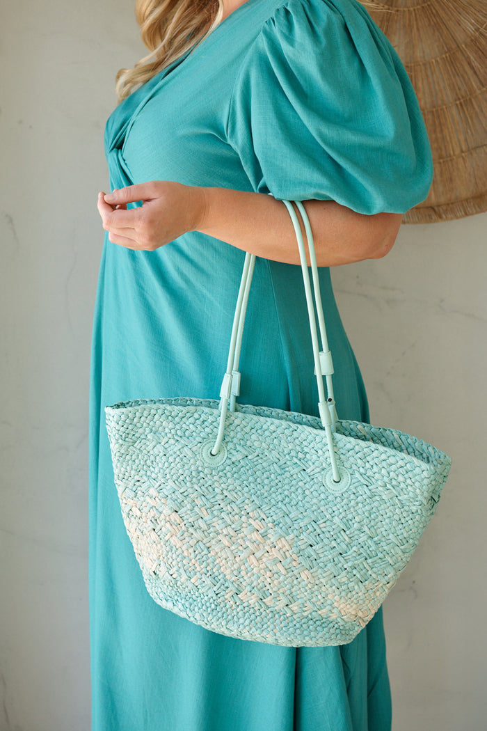 Sorrento Tote Bag in Aqua and Beige Raffia campaign on model side