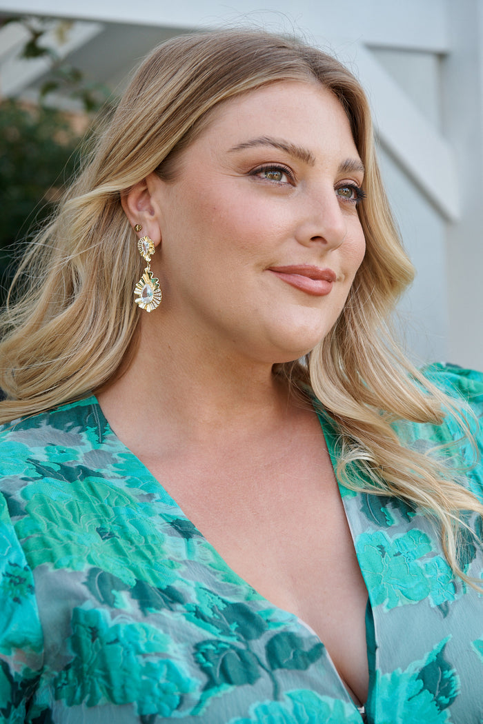 Sabine Drop Teardrop Earrings in Textured Gold campaign on model side