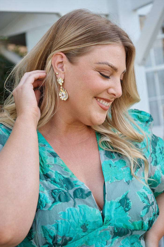 Sabine Drop Teardrop Earrings in Textured Gold campaign on model side