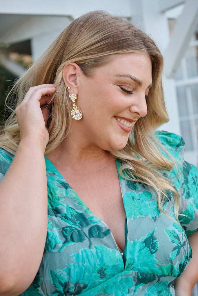 Sabine Drop Teardrop Earrings in Textured Gold campaign on model side