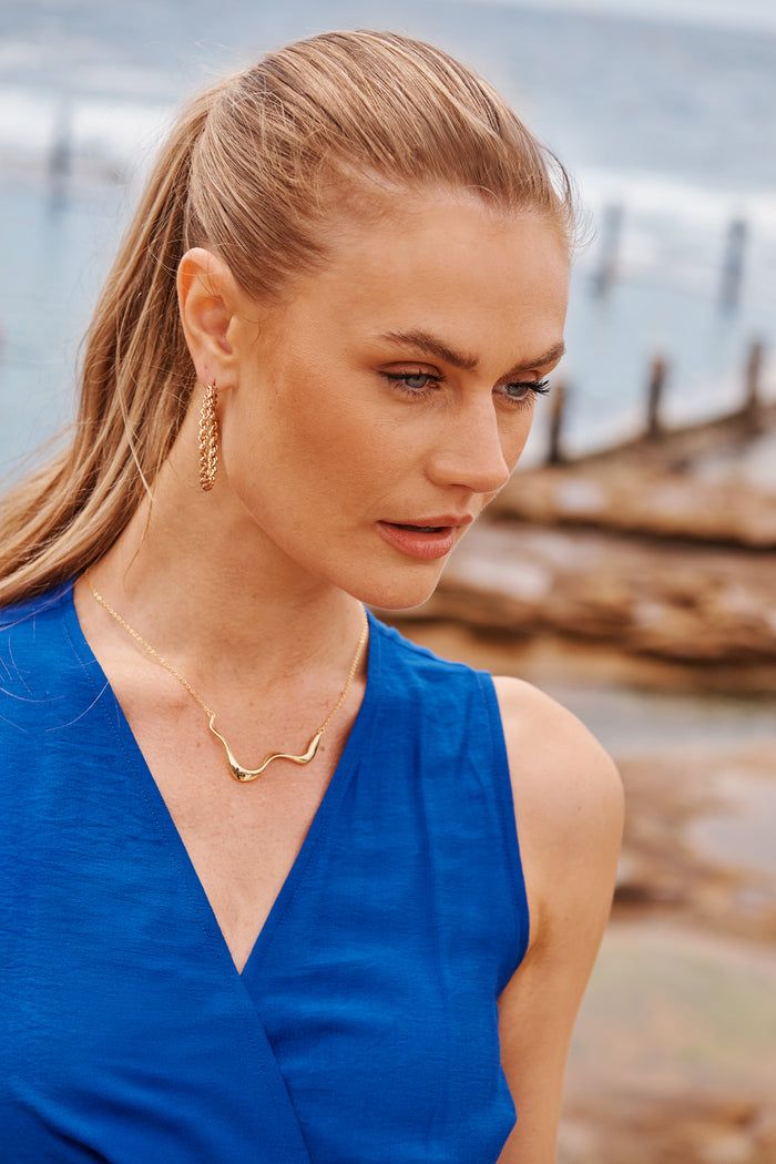 Kaia Molten Necklace in Gold campaign on model side