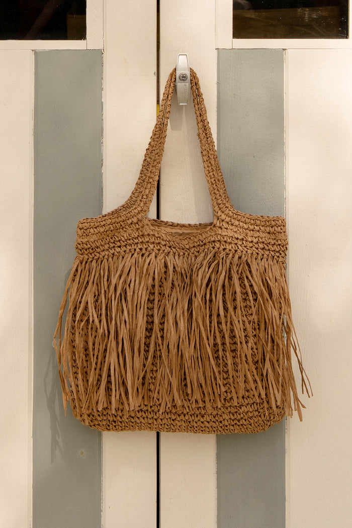 Frisco Fringe Shoulder Tote Bag in Natural Raffia campaign flatlay