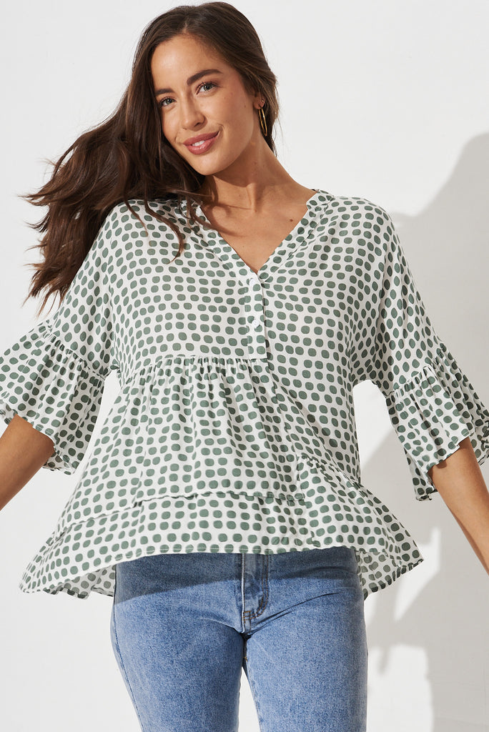 Relia Top In White With Green Polka Dot - front