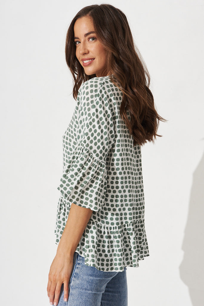 Relia Top In White With Green Polka Dot - side